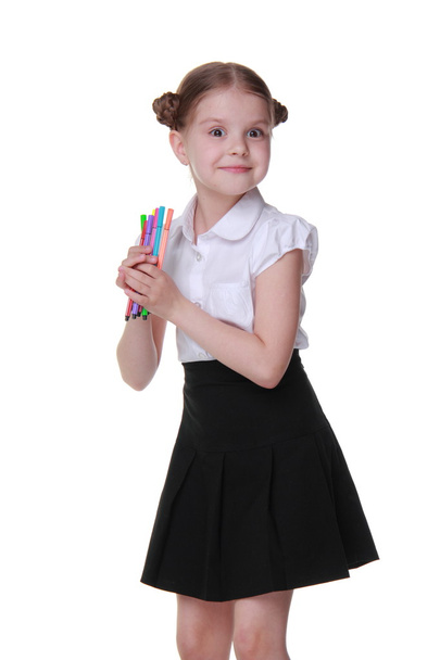 Studio portrait of schoolgirl with felt-tip pens - Foto, imagen