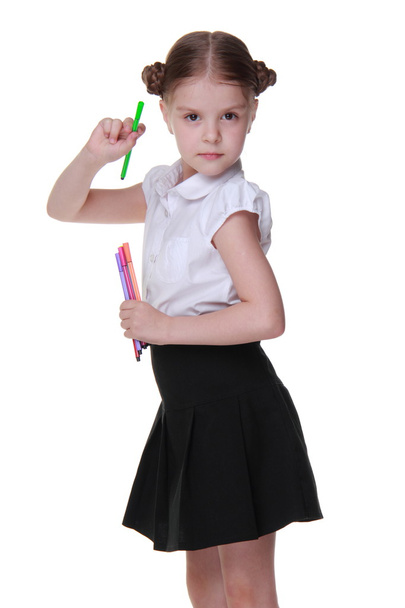 Studio portrait of schoolgirl with felt-tip pens - Foto, afbeelding