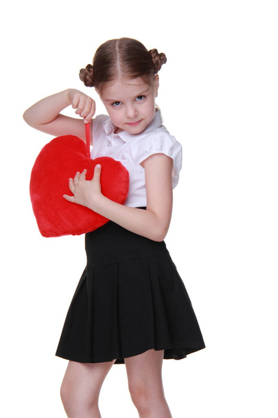 Caucasian schoolgirl with red heart symbol - Zdjęcie, obraz