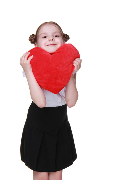 Caucasian schoolgirl with red heart symbol - Foto, immagini