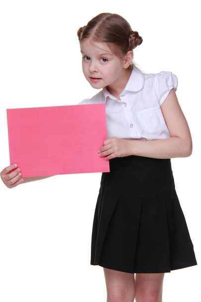 Щаслива школярка з аркушем паперу
 - Фото, зображення