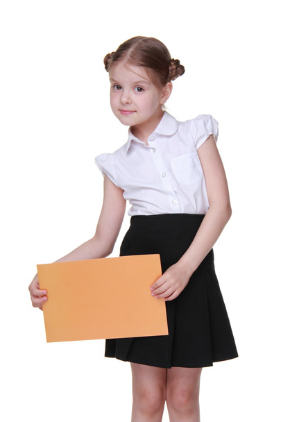 Happy schoolgirl with a sheet of paper - Zdjęcie, obraz