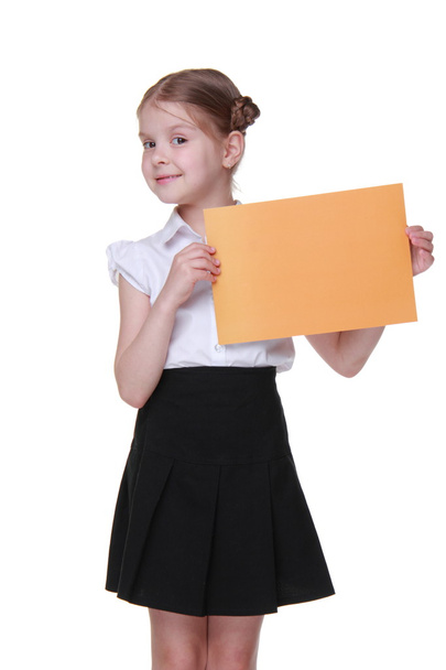 Happy schoolgirl with a sheet of paper - Foto, Bild