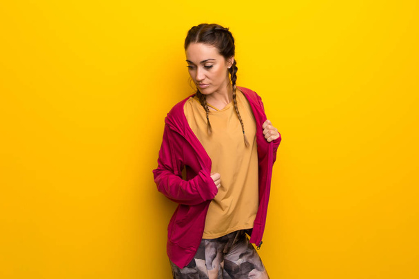 Sport woman on vibrant yellow background - Photo, Image