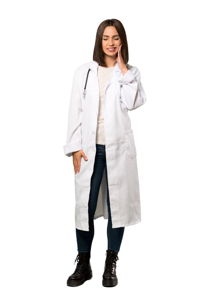 A full-length shot of a Young doctor woman with toothache over isolated white background - Photo, Image