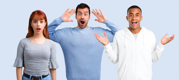 Group of three friends with surprise and shocked facial expression - Photo, Image