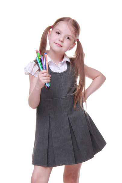 Studio portrait of schoolgirl with felt-tip pens - Foto, Imagen