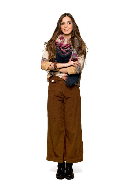 Full-length shot of Young hippie woman keeping the arms crossed in frontal position on isolated white background - Photo, image