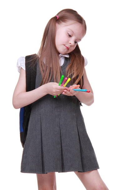 Studio portrait of schoolgirl with felt-tip pens - Valokuva, kuva