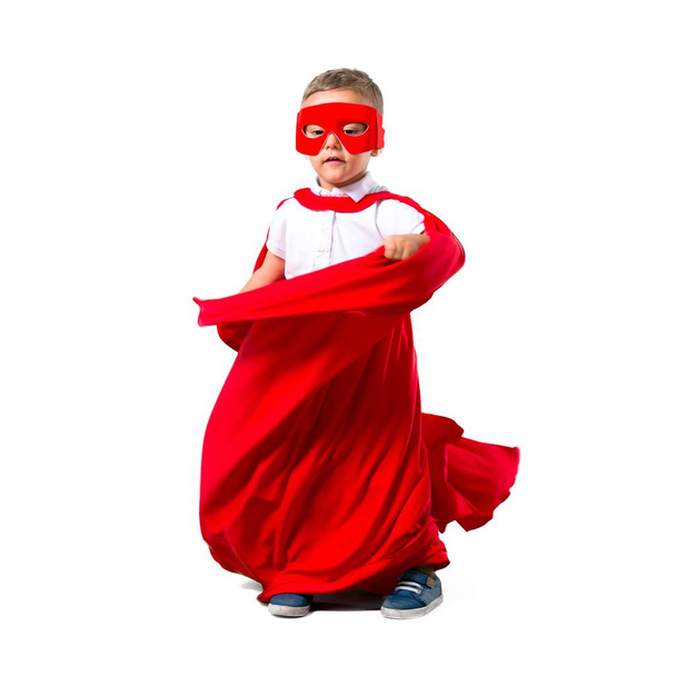 Little kid dressed like superhero on isolated white background - Foto, afbeelding
