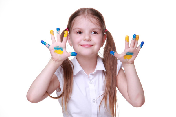 Happy little girl in with hands painted as ukrainian flag - Foto, afbeelding