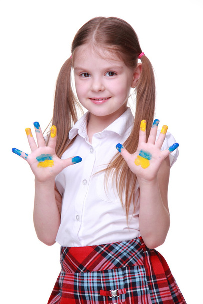 Happy little girl with hands painted as ukrainian flag - Фото, изображение