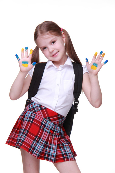 Happy little girl with hands painted as ukrainian flag - Valokuva, kuva