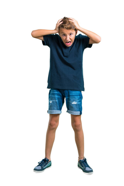 Full body of Little boy unhappy and frustrated with something. Negative facial expression on white background - Foto, imagen