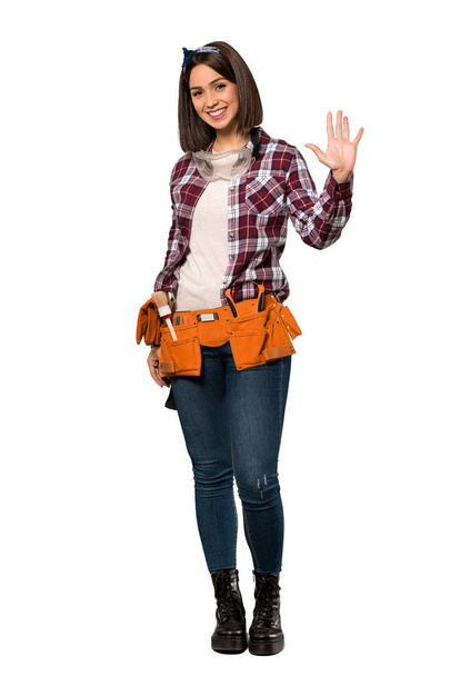 A full-length shot of a Young worker woman saluting with hand with happy expression over isolated white background - 写真・画像