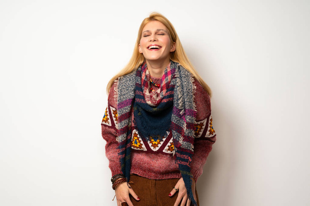Hippie woman over white wall smiling a lot while putting hands on chest - Fotografie, Obrázek