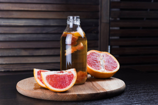 kombucha with grapefruit wooden background - Photo, image