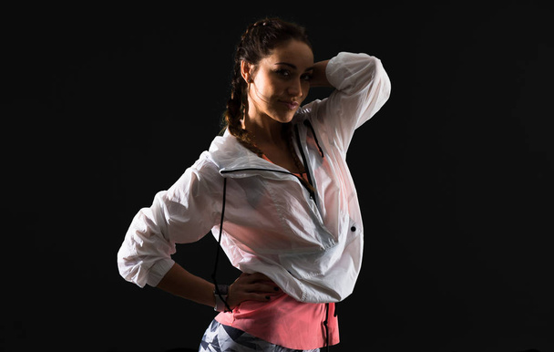 Sport woman on dark background - Foto, Bild