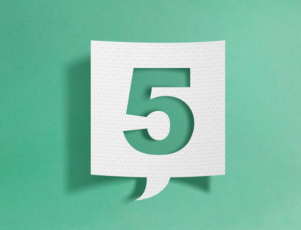 Speech bubble with number 5 on green background - Photo, Image
