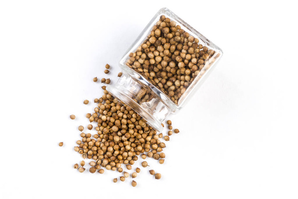 coriander seeds in a glass jar isolated on white background. top view - Photo, Image