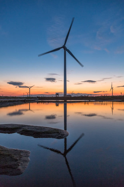 Wind turbines on landscape in sunset. - Photo, Image