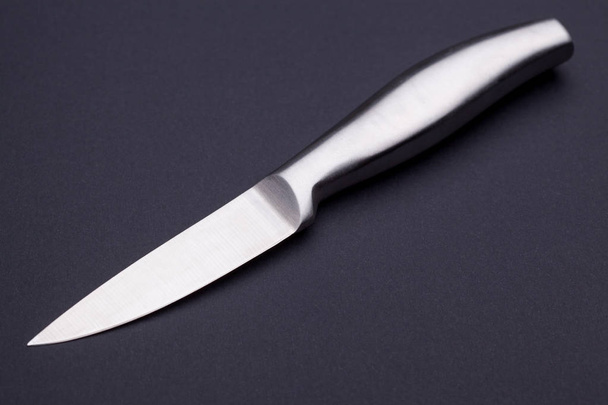steel kitchen knife on the black background - Fotó, kép