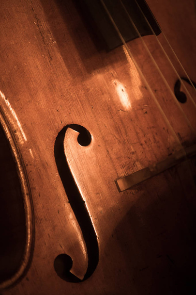 Close up shot of a double bass f hole. - Фото, изображение