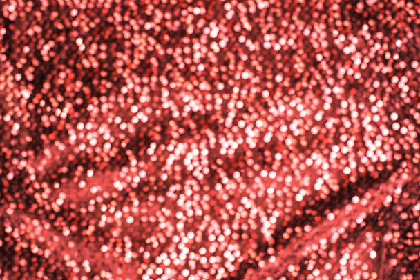 schimmernde festliche Hintergrund glänzende Korallen Textur. abstrakter Hintergrund mit kleinen Lichtern defokussieren - Foto, Bild
