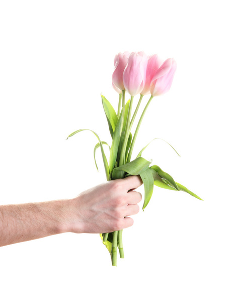 Beautiful bouquet of pink tulips in man hand, isolated on white - Fotografie, Obrázek