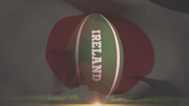 Cyfrowy kompozytowy gracz rugby, kopiąc piłkę narodu irlandzkiego z japońską flagę macha na tle  - Materiał filmowy, wideo