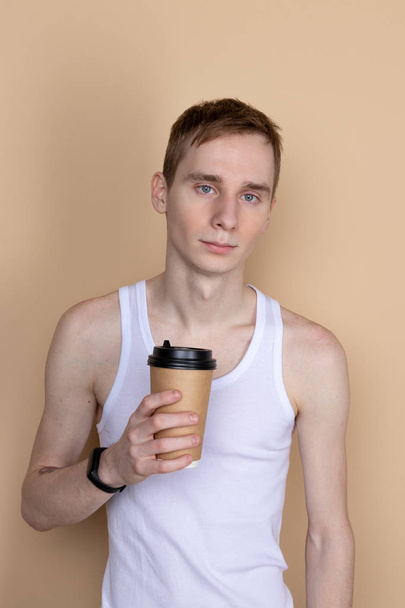 Guy drink from coffee or tea cup - Fotó, kép