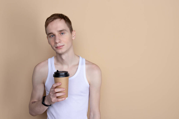 Guy drink from coffee or tea cup - Fotó, kép