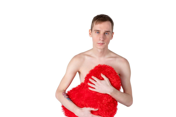 Handsome guy hold big red heart on white background. Love and romantic concept. - Foto, Imagen