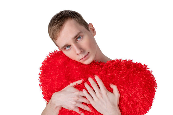 Handsome guy hold big red heart on white background. Love and romantic concept. - Zdjęcie, obraz