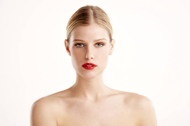 Close-up portrait of beautiful young woman with red lipstick and blond hair looking at camera while posing at isolated white background. - Φωτογραφία, εικόνα