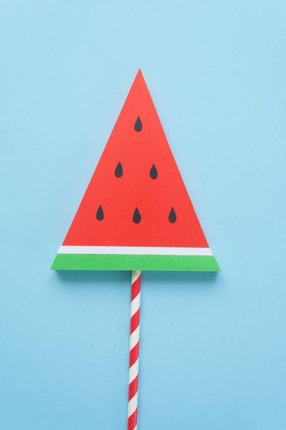fruit candies, the concept of sweets, made of paper on blue background. Watermelon candy - Photo, image