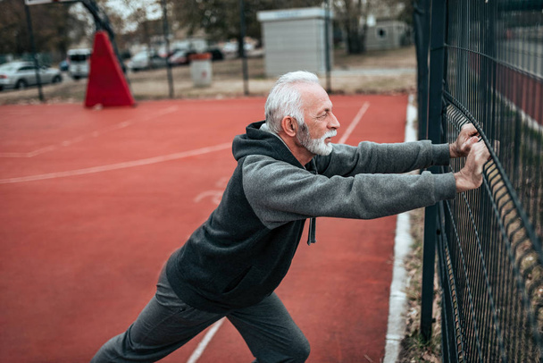 Senior man exercising outdoors. - Fotoğraf, Görsel
