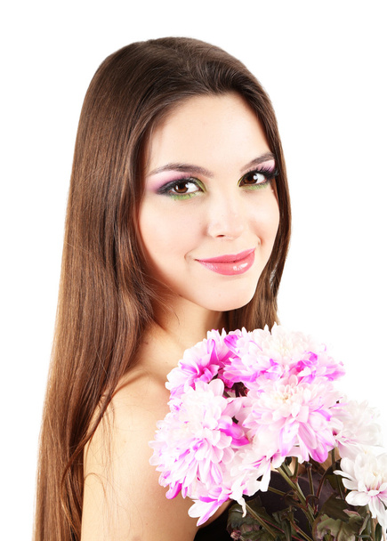 Young beautiful girl with nice flowers in her hand, isolated on white - Zdjęcie, obraz
