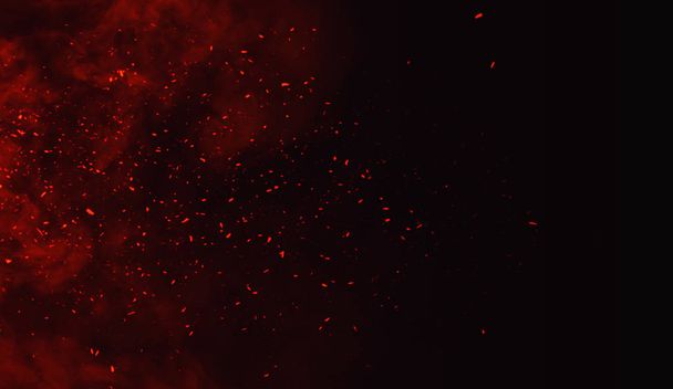 Fire particles debris isolated on black background for text or space . Film texture effect. - Zdjęcie, obraz