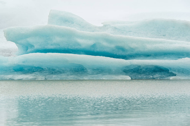 Closeup of iceberg in Fjallsarlon glacier lagoon in Vatnajokull National Park, Iceland - 写真・画像