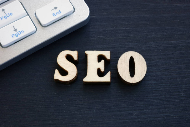 Abbreviation SEO- Search Engine Optimization from wooden letters. - Foto, imagen
