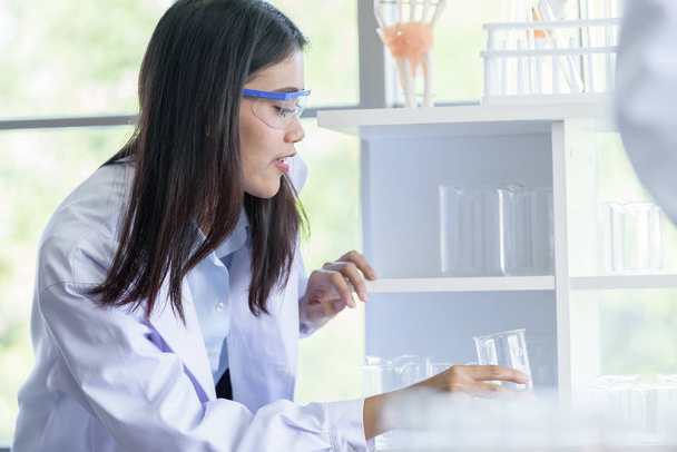 Asian young girl student scientist researching  and learning in a laboratory. - Photo, Image