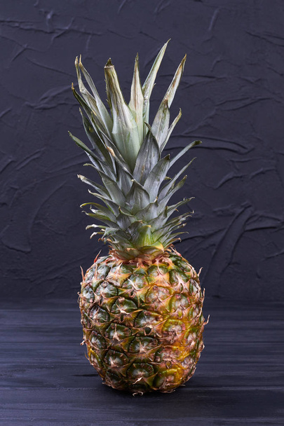 Ripe pineapple on slate background. - Photo, Image