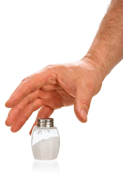 Hand taking salt cellar - Photo, image