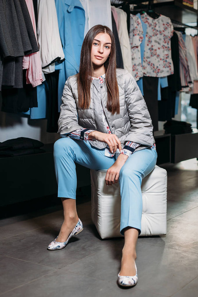 shopping, fashion, style, sale, shopping, business and people. concept beautiful happy young woman in a clothing store. the business owner is a clothing store. businesswoman - Fotoğraf, Görsel