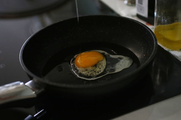 egg is fried in a pan - Photo, Image