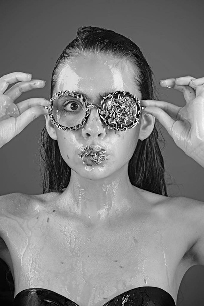 Makeup of sugar candy kiss on lips. Beauty and fashion model of glamour girl. Young woman with sprinkles makeup. Sprinkles lipstick and glasses on girl, valentines day. Diet and sweet dessert, easter. - Zdjęcie, obraz