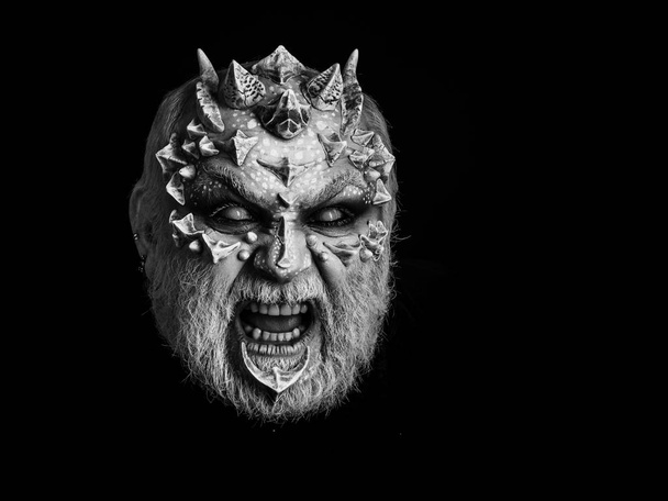 Evil face with dragon skin and grey beard - Foto, imagen