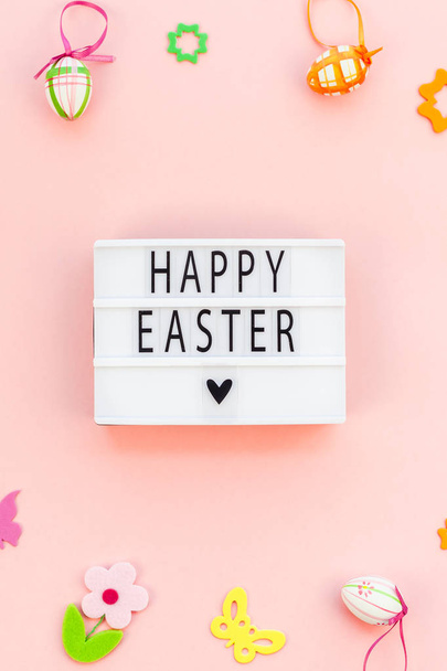 Creative Top view flat lay holiday composition Happy Easter text on lightbox pink paper background copy space Template Easter day seasonal pattern - Foto, immagini