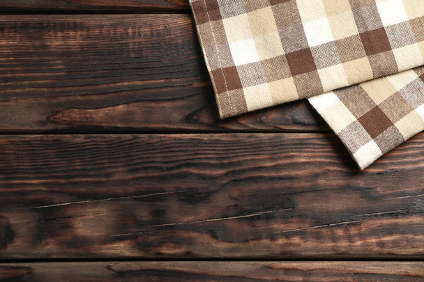 Fabric ubrousky na dřevěné pozadí, prostor pro text - Fotografie, Obrázek